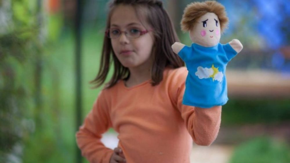 Claudia, 7 ans, participe au concours "Mannequins exceptionnels" (photo extraite de la page Facebook Hop'Toys)