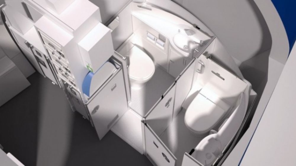 Une cloison mobile pour une cabine de toilette accessible en fauteuil roulant